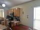 Cozy kitchen featuring wood cabinetry and laminate countertops at 5030 Silver Thistle Ln, St Cloud, FL 34772