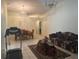 Spacious living room featuring tile floors and neutral walls, perfect for relaxing or entertaining guests at 5030 Silver Thistle Ln, St Cloud, FL 34772