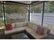Comfortable seating arrangement with cushions, creating an outdoor gathering spot at 5030 Silver Thistle Ln, St Cloud, FL 34772