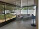 Screened patio with comfortable seating, creating an inviting outdoor living space at 5030 Silver Thistle Ln, St Cloud, FL 34772