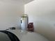 A storage room with a water heater installed. There is room to use as a storage area at 5030 Silver Thistle Ln, St Cloud, FL 34772