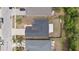 An aerial view of a house with a fenced backyard and neighboring homes on a residential street at 5210 Silver Thistle Ln, St Cloud, FL 34772