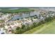 An aerial view of a neighborhood with community lake and homes at 5210 Silver Thistle Ln, St Cloud, FL 34772