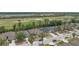 Residential neighborhood with manicured lawns near a golf course and water containment area at 5210 Silver Thistle Ln, St Cloud, FL 34772