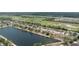 Serene community homes surrounding a lake and lush golf course, offering a picturesque neighborhood at 5210 Silver Thistle Ln, St Cloud, FL 34772