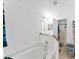 Bright bathroom featuring a large soaking tub and tiled floors at 5210 Silver Thistle Ln, St Cloud, FL 34772