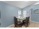 Dining area with table, four chairs, and a window with blinds at 5210 Silver Thistle Ln, St Cloud, FL 34772