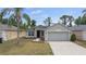Charming single-story home featuring a well-maintained front yard, attached two-car garage, and neutral colored paint at 5210 Silver Thistle Ln, St Cloud, FL 34772