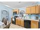 Kitchen area featuring modern appliances and an archway view to the dining area at 5210 Silver Thistle Ln, St Cloud, FL 34772