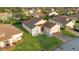 Inviting home with manicured lawn, paver driveway, and attached garage, set in a lovely neighborhood at 5253 Pebble Beach Blvd, Winter Haven, FL 33884