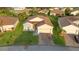 Charming home with well-kept landscaping, a paved driveway, and a two-car garage, in a friendly neighborhood at 5253 Pebble Beach Blvd, Winter Haven, FL 33884