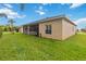 The home has a large, well-manicured lawn and a screened lanai, perfect for enjoying the outdoors at 5253 Pebble Beach Blvd, Winter Haven, FL 33884