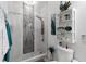 Modern bathroom with stone shower and decorative shelving at 5253 Pebble Beach Blvd, Winter Haven, FL 33884