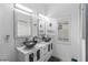 Modern bathroom featuring double vanities, vessel sinks, mosaic tile accents, and ample lighting at 5253 Pebble Beach Blvd, Winter Haven, FL 33884
