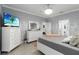 Bedroom with white dressers, views into ensuite bathroom at 5253 Pebble Beach Blvd, Winter Haven, FL 33884