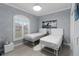 Neutral bedroom with window and decorative wall art at 5253 Pebble Beach Blvd, Winter Haven, FL 33884