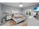 Neutral bedroom design with white furniture and bedside decor at 5253 Pebble Beach Blvd, Winter Haven, FL 33884