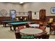 Enjoy billiards in this community space with multiple tables and ample seating for socializing at 5253 Pebble Beach Blvd, Winter Haven, FL 33884