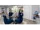 Cozy dining room featuring a glass table, decorative chairs, and ample natural light at 5253 Pebble Beach Blvd, Winter Haven, FL 33884