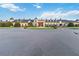 Stately community clubhouse with manicured landscaping and water feature, offering a luxurious ambiance at 5253 Pebble Beach Blvd, Winter Haven, FL 33884