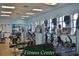 Bright fitness center with treadmills, weight machines, TVs and other exercise equipment at 5253 Pebble Beach Blvd, Winter Haven, FL 33884