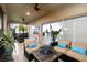 Inviting screened lanai with comfortable seating, ceiling fans, and views of lush landscaping at 5253 Pebble Beach Blvd, Winter Haven, FL 33884
