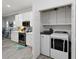 Bright kitchen and laundry room area features modern appliances and ample storage space at 5253 Pebble Beach Blvd, Winter Haven, FL 33884
