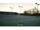 Well-maintained tennis courts with lighting for evening play at 5253 Pebble Beach Blvd, Winter Haven, FL 33884