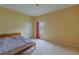 Bright bedroom featuring neutral walls, carpet floors, a window, and a closet at 5418 Crepe Myrtle Cir, Kissimmee, FL 34758