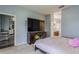 Bedroom with view of en suite bathroom, plus TV at 5418 Crepe Myrtle Cir, Kissimmee, FL 34758