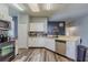 Bright kitchen with white cabinets, stainless steel appliances, and stylish backsplash at 5418 Crepe Myrtle Cir, Kissimmee, FL 34758