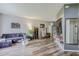 Modern living room features hardwood floors, stylish furniture, and decorative lighting at 5418 Crepe Myrtle Cir, Kissimmee, FL 34758