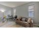 A well-lit living room provides a comfortable seating area at 5418 Crepe Myrtle Cir, Kissimmee, FL 34758