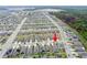 Expansive community with homes, green spaces, and roadways, designed for modern living in a suburban landscape at 5876 Bar Ranch Rd, St Cloud, FL 34771