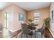 Cozy breakfast nook featuring seating for four, natural light, and access to the outdoor living area at 5876 Bar Ranch Rd, St Cloud, FL 34771