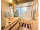 Bathroom featuring a vanity, toilet, and glass-enclosed shower/tub combination at 622 Dromedary Ct, Kissimmee, FL 34759
