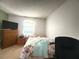 Bedroom with bed, dresser, and natural light coming through the window at 622 Dromedary Ct, Kissimmee, FL 34759