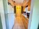 Kitchen featuring tile flooring, white appliances, and ample counter space at 622 Dromedary Ct, Kissimmee, FL 34759