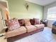 Comfortable living room with a large sofa and neutral decor at 622 Dromedary Ct, Kissimmee, FL 34759