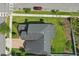 Aerial view of the roof and manicured lawn of a residential property at 8378 Randal Park Blvd, Orlando, FL 32832