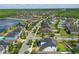 Sprawling community with well-maintained homes, green spaces, and a serene lake view, providing a peaceful neighborhood at 8378 Randal Park Blvd, Orlando, FL 32832