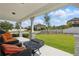 Relaxing covered porch with outdoor seating and well-manicured lawn at 8378 Randal Park Blvd, Orlando, FL 32832
