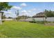 Expansive backyard with manicured lawn, privacy fence, and space for gardening at 8378 Randal Park Blvd, Orlando, FL 32832