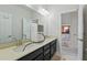 Bathroom featuring double sinks and a large mirror at 8378 Randal Park Blvd, Orlando, FL 32832