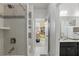 Bright bathroom featuring modern shower and view to a playroom at 8378 Randal Park Blvd, Orlando, FL 32832