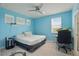 Comfortable bedroom with ceiling fan, carpet, and bright walls at 8378 Randal Park Blvd, Orlando, FL 32832