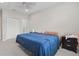 Inviting bedroom with closet and doorway to additional rooms at 8378 Randal Park Blvd, Orlando, FL 32832