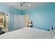 Bedroom featuring a ceiling fan, closet, and bright walls at 8378 Randal Park Blvd, Orlando, FL 32832