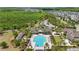 Aerial view of community pool with lap lanes, surrounded by landscaping and neighborhood homes at 8378 Randal Park Blvd, Orlando, FL 32832