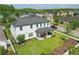 Attractive two-story home with a well-manicured lawn and inviting front porch, perfect for enjoying the outdoors at 8378 Randal Park Blvd, Orlando, FL 32832